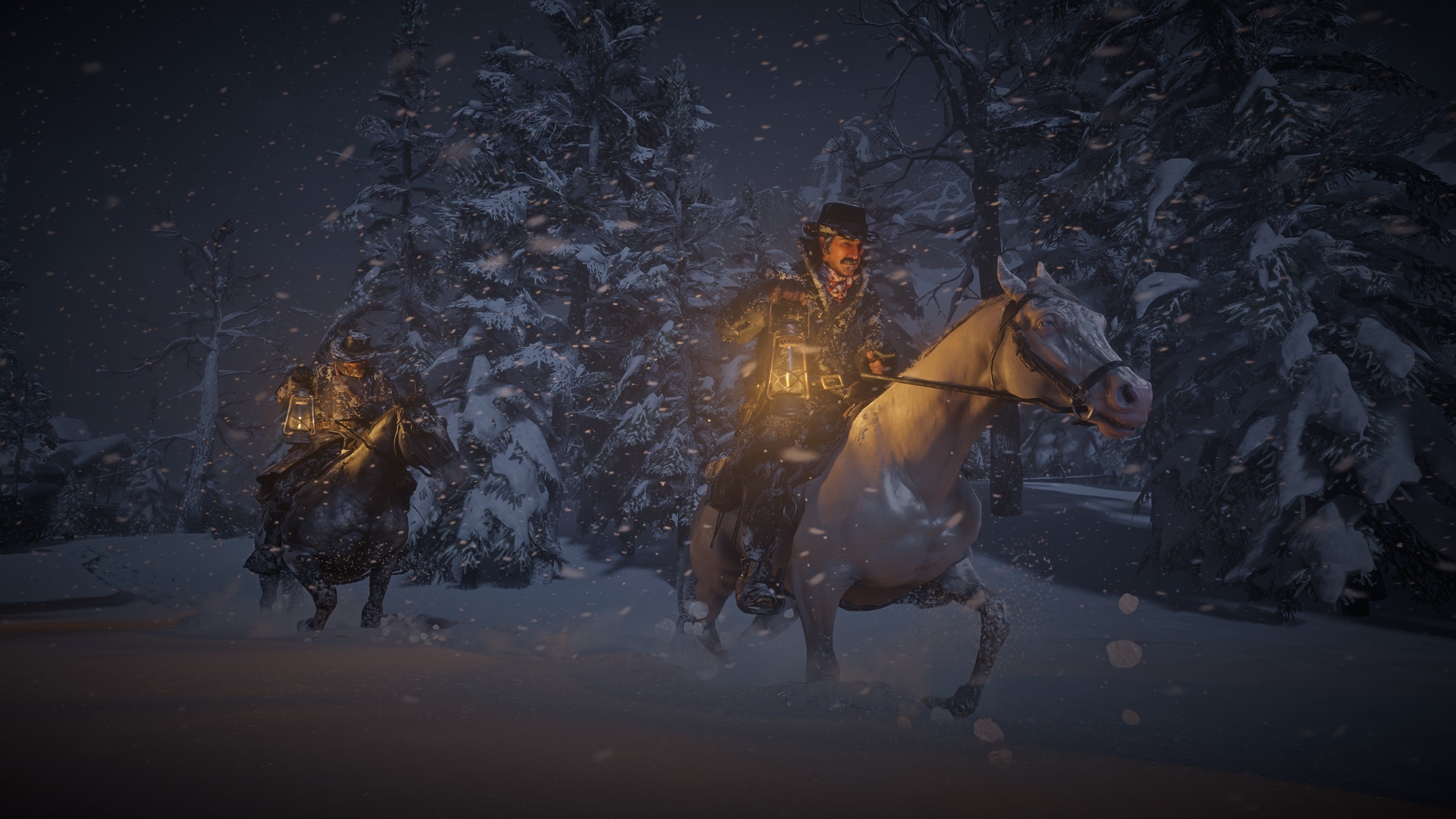 People on horses while snowing